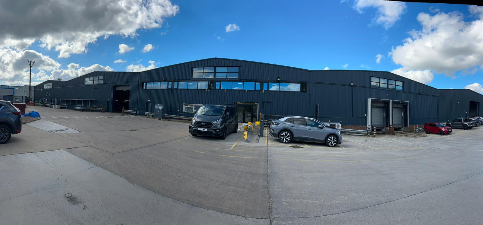 Industrial unit exterior repaint, dark grey cladding